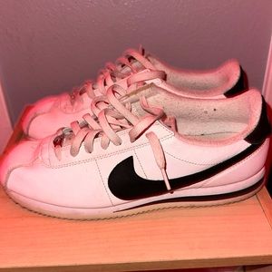 white and black nike cortez